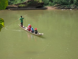 The boys enter the Nam Ha NPA via the Nam Tha River on a tippy canoe