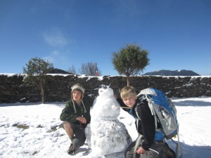 Carolina boys learn to make a snowman, front yard of the yak cheese factory, Shin Gompa