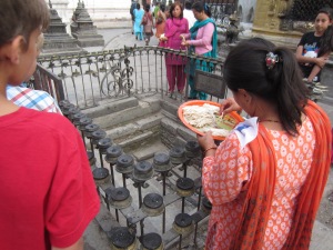 Preparing the butter lamps around the Nagpura (water symbol), Swayambhunath
